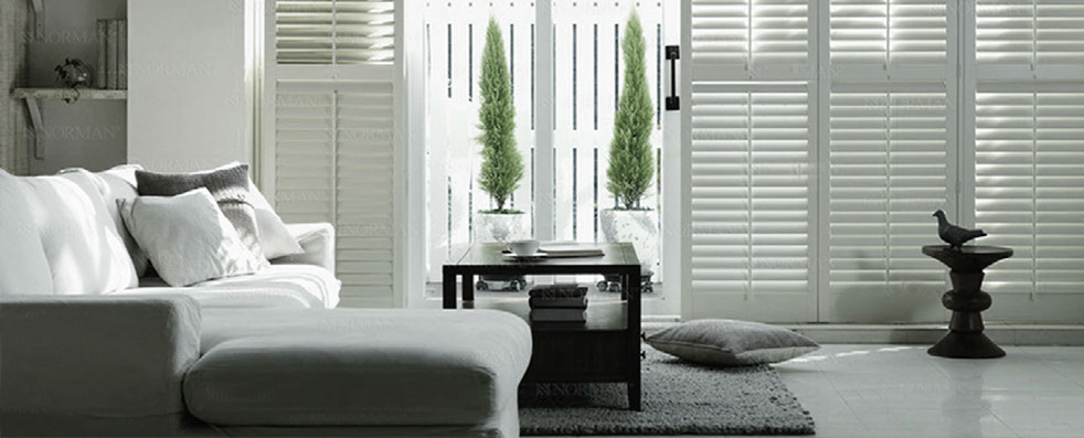 lounge interior design white shutters stone colours